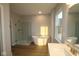 Luxurious primary bathroom featuring a soaking tub and glass shower enclosure at 1114 Ridgevine Rd, Greenwood, IN 46143