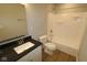 Modern bathroom with sleek vanity and shower-tub combo at 1114 Ridgevine Rd, Greenwood, IN 46143