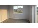 Bright bedroom with neutral walls, plush carpet, and a window offering natural light at 1114 Ridgevine Rd, Greenwood, IN 46143