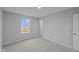 Bright bedroom with soft carpet, window with outside view, and ample natural light at 1114 Ridgevine Rd, Greenwood, IN 46143