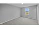 Bedroom features soft carpet, view from the window, and neutral walls at 1114 Ridgevine Rd, Greenwood, IN 46143