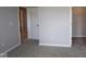A carpeted bedroom features access to a walk-in closet and an adjoining bathroom at 1114 Ridgevine Rd, Greenwood, IN 46143