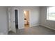 Bright bedroom with an ensuite bathroom, neutral walls, carpet and large windows at 1114 Ridgevine Rd, Greenwood, IN 46143