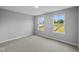 Bright bedroom featuring plush carpeting and large windows with a view at 1114 Ridgevine Rd, Greenwood, IN 46143
