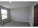 A quiet bedroom offers neutral carpet, paint, a window, and closet at 1114 Ridgevine Rd, Greenwood, IN 46143