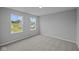 Bright bedroom featuring plush carpeting and large windows with a view at 1114 Ridgevine Rd, Greenwood, IN 46143