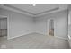 Spacious bedroom with neutral gray walls, plush carpet and tray ceiling at 1114 Ridgevine Rd, Greenwood, IN 46143