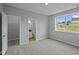 Bedroom with a bathroom and closet, a window, and neutral walls at 1114 Ridgevine Rd, Greenwood, IN 46143