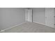 Neutral bedroom with soft carpet and doors to other rooms at 1114 Ridgevine Rd, Greenwood, IN 46143