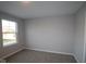 Bright bedroom with a window and neutral walls at 1114 Ridgevine Rd, Greenwood, IN 46143