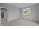 Bedroom features soft carpet, view from the window, and neutral walls at 1114 Ridgevine Rd, Greenwood, IN 46143