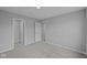Neutral bedroom with a walk-in closet and plush gray carpet at 1114 Ridgevine Rd, Greenwood, IN 46143