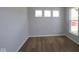 Bedroom with hardwood floors, natural light, and three windows at 1114 Ridgevine Rd, Greenwood, IN 46143