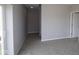 Bonus room featuring neutral walls, carpeted floors, a sliding glass door, and an additional doorway at 1114 Ridgevine Rd, Greenwood, IN 46143