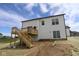 The backyard of a home under construction features a wood deck with stairs and freshly laid sod at 1114 Ridgevine Rd, Greenwood, IN 46143