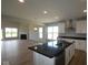 Open kitchen with stainless steel appliances, island, hardwood floors and lots of natural light at 1114 Ridgevine Rd, Greenwood, IN 46143