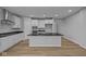 Well-lit kitchen featuring white cabinets, granite countertops, and stainless steel appliances at 1114 Ridgevine Rd, Greenwood, IN 46143