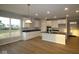 Stylish kitchen with white cabinets, stainless steel appliances, and hardwood floors at 1114 Ridgevine Rd, Greenwood, IN 46143