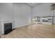 Open-concept living area with a fireplace, high ceilings, and a modern kitchen at 1114 Ridgevine Rd, Greenwood, IN 46143