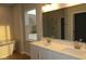 Spa-like bathroom featuring double sinks, soaking tub, and a glass enclosed shower at 1114 Ridgevine Rd, Greenwood, IN 46143