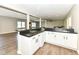 Basement bar with seating, white cabinets and new appliances at 11862 Stoney Bay Cir, Carmel, IN 46033