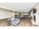 Open-concept basement with fireplace, wood floors and comfortable seating at 11862 Stoney Bay Cir, Carmel, IN 46033