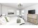 Comfortable bedroom with natural light, carpet floors and calming decor at 11862 Stoney Bay Cir, Carmel, IN 46033