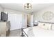 Cozy bedroom with neutral walls, large closet and modern light fixture at 11862 Stoney Bay Cir, Carmel, IN 46033