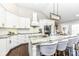 Modern kitchen with granite countertops, stainless steel appliances, and breakfast bar at 11862 Stoney Bay Cir, Carmel, IN 46033