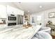 Gourmet kitchen with stainless steel appliances, granite island, and access to backyard at 11862 Stoney Bay Cir, Carmel, IN 46033