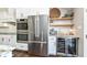 Kitchen includes stainless steel appliances, custom cabinets, and wine storage at 11862 Stoney Bay Cir, Carmel, IN 46033