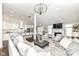 Open-concept living room seamlessly integrates with a gourmet kitchen, perfect for modern living at 11862 Stoney Bay Cir, Carmel, IN 46033