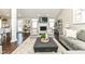 Cozy living room with fireplace, large area rug, and neutral color palette at 11862 Stoney Bay Cir, Carmel, IN 46033