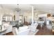 Open-concept layout with living room flowing into a modern kitchen area at 11862 Stoney Bay Cir, Carmel, IN 46033
