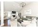 Bright living room features vaulted ceiling, fireplace, and comfortable seating arrangement at 11862 Stoney Bay Cir, Carmel, IN 46033