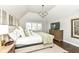 Charming main bedroom boasting ample natural light, comfortable carpet, and an attractive ceiling fan at 11862 Stoney Bay Cir, Carmel, IN 46033