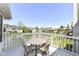 Spacious patio overlooking a serene lake with comfortable seating at 11862 Stoney Bay Cir, Carmel, IN 46033