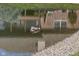 Tranquil pond view featuring turtles basking on a wooden platform, adding natural charm to the property's surroundings at 11862 Stoney Bay Cir, Carmel, IN 46033