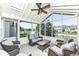 Relaxing sunroom with comfortable seating and beautiful lake views at 11862 Stoney Bay Cir, Carmel, IN 46033
