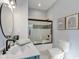 A well-lit bathroom with a double vanity, shower and toilet at 125 W Noble St, Lebanon, IN 46052