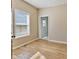 This cozy bedroom has wood-look floors, a large window, neutral paint, and white trim at 125 W Noble St, Lebanon, IN 46052