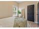 Bedroom featuring a comfy bed, neutral décor, a mirror and a window at 125 W Noble St, Lebanon, IN 46052