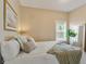 Relaxing bedroom with a comfortable bed, window, and mirror at 125 W Noble St, Lebanon, IN 46052