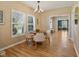Dining room with hardwood floors, natural light, and view to sitting room at 125 W Noble St, Lebanon, IN 46052