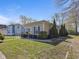 Inviting home with mature trees and a lush green lawn at 125 W Noble St, Lebanon, IN 46052