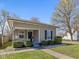 Cozy home showcasing a manicured lawn, inviting porch, and classic architectural details at 125 W Noble St, Lebanon, IN 46052