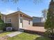 Exterior of a cozy home with a wooden deck, small lawn, and neutral vinyl siding at 125 W Noble St, Lebanon, IN 46052