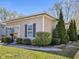 Well-maintained home featuring mature evergreens and a manicured lawn and walkway at 125 W Noble St, Lebanon, IN 46052