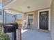 Comfortable front porch with seating, a welcoming mat, and a decorative wreath on the door at 125 W Noble St, Lebanon, IN 46052