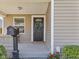 Inviting front porch featuring a decorative wreath and a stylish mailbox at 125 W Noble St, Lebanon, IN 46052